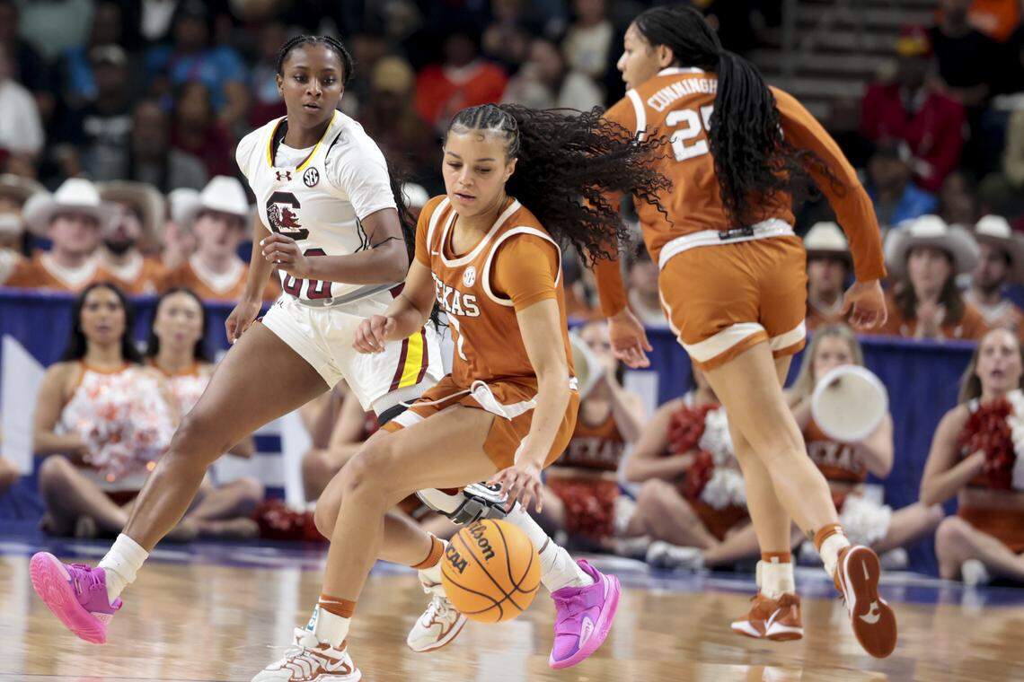 South Carolina's Ta'Niya Latson (00) pressures Texas’s Jordan Lee (7) during the second half of action of their women's basketball game in the SEC Tournament, against Texas at the Bon Secours Wellness Arena on Sunday, March 8, 2026. Texas defeated South Carolina 78-61.