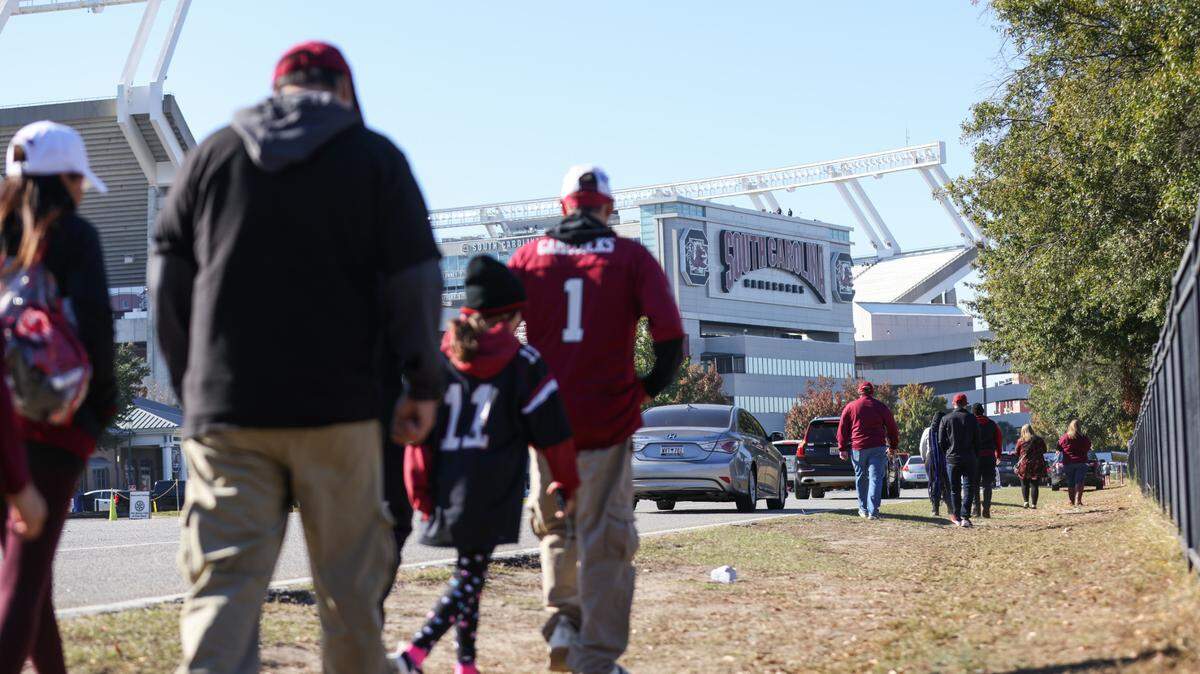 Fans make their way down George Rogers Boulevard before the Gamecocks’ game at Williams-Brice Stadium in Columbia on Saturday, November 4, 2023.