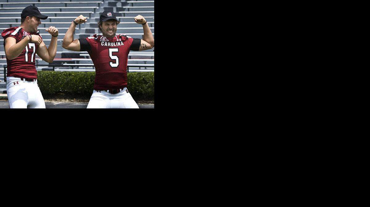 Columbia, SC--USC football players gather for portraits during media day at Williams-Brice stadium.   Here ( l to r) Dylan Thompson, Stephen Garcia, Andrew Clifford and Tanner McEvoy--all listed as USC QB's on the USC football roster, show off their guns.  

Anne McQuary /www.heybabysmile.com