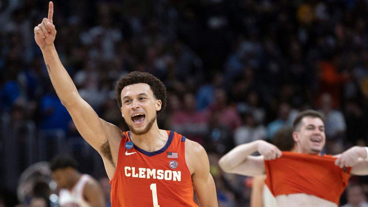 Clemson’s Chase Hunter (1) and Joseph Girard III (11) celebrate the Tigers’ 77-72 victory over Arizona in the NCAA Sweet Sixteen on Thursday, March 28, 2024 at Crypto.com Arena in Los Angeles, CA.