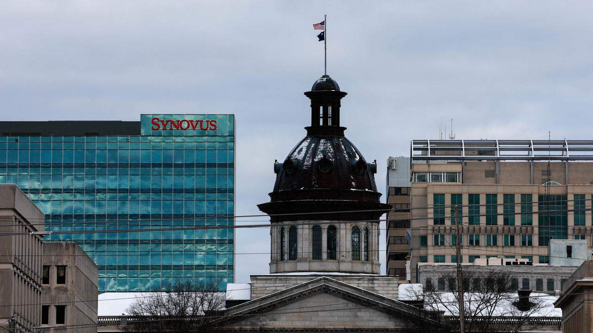 Snow covers the State House dome in downtown Columbia as winter weather blankets the area on Saturday, Jan. 22, 2022.
