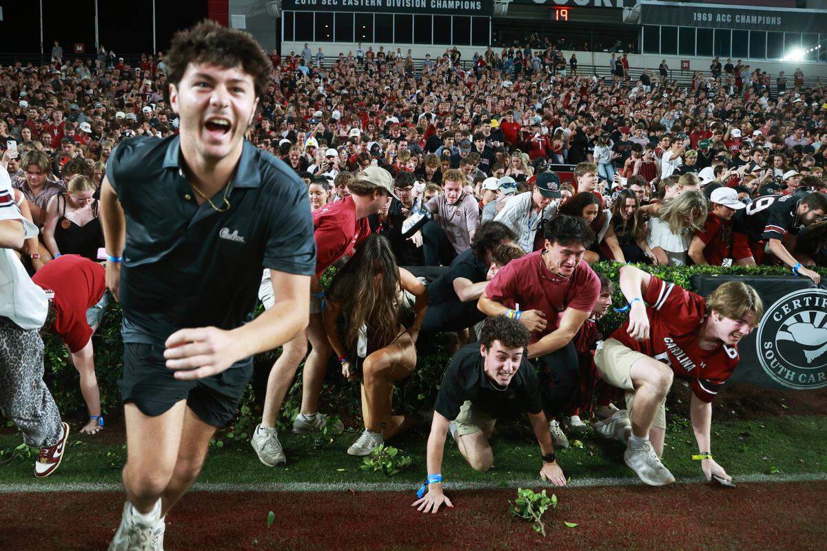 South Carolina fans rush the field after their team beat Texas A&M at Williams-Brice Stadium on Nov. 2, 2024. 