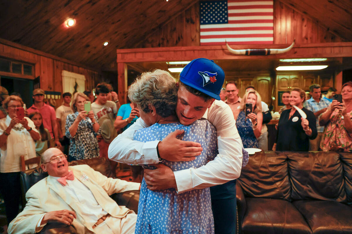 Tucker Toman celebrates with his grandmother, Carol Ann McLaughlin and family and friends after being picked to play for the Toronto Blue Jays on Sunday, July 17, 2022.