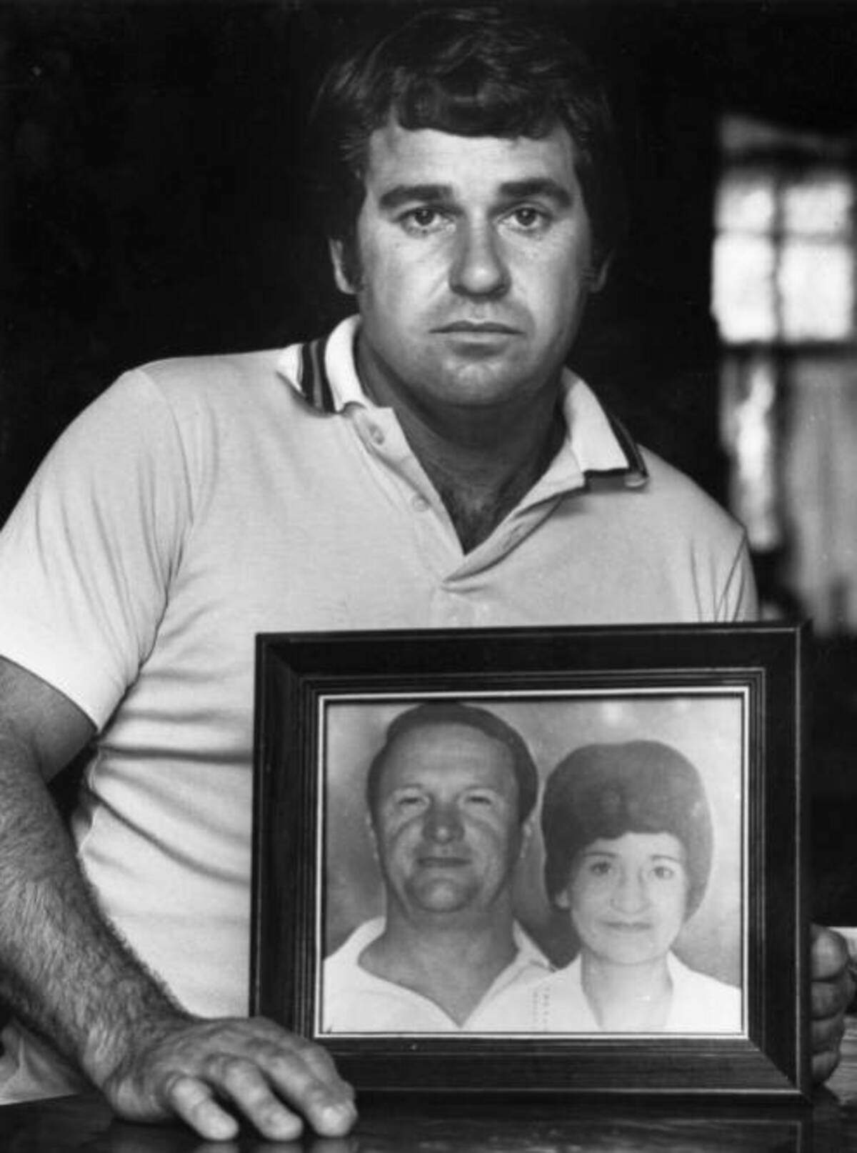 In 1983, Richard “Tony” Cimo holds a portrait of his parents, Bill and Myrtle Moon, who were killed in 1978 during a robbery in Murrells Inlet. Cimo is charged in hiring Pee Wee Gaskins to kill their murderer, Rudolph Tyner. Tyner was serving time on death row in Columbia when Gaskins used a home-made bomb to murder Tyner, who was a fellow inmate of Gaskins’ at the Central Correctional Institution in Columbia.