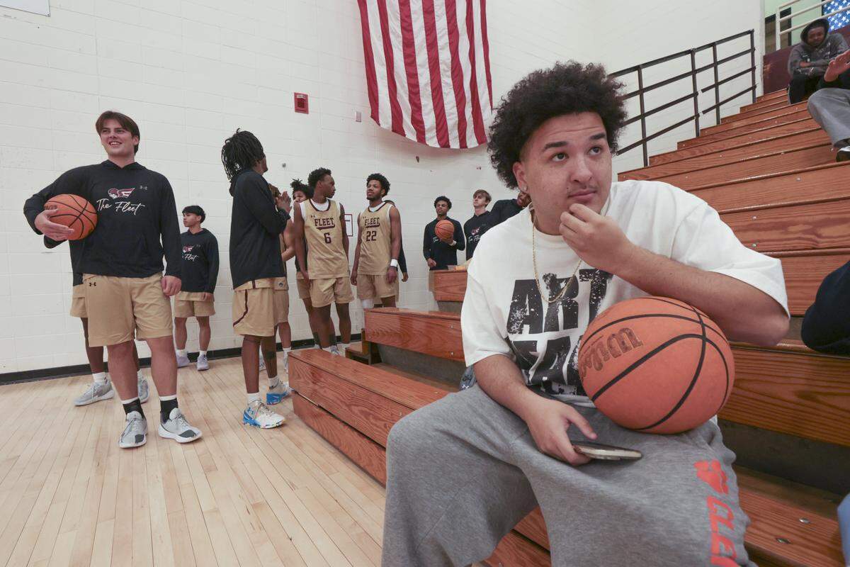 Erskine developmental player Jason Swann sits on the bleachers as the varsity team prepares to take the court for a game on Wednesday, Jan. 21, 2026.