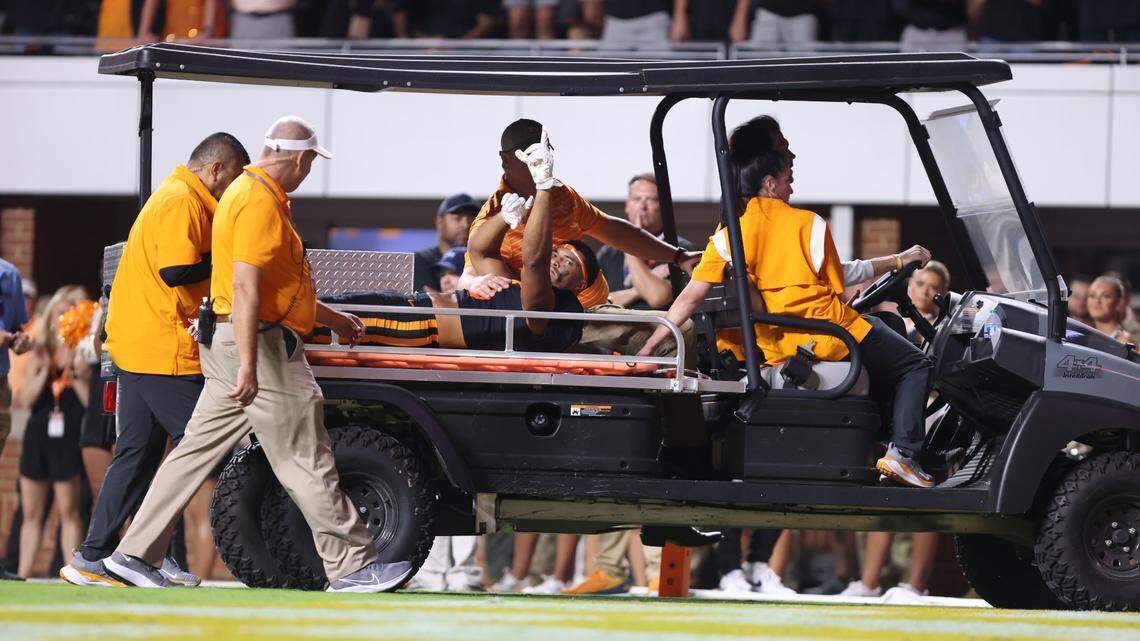 Tennessee’s Bru McCoy is carted off the field after a second-quarter leg injury against South Carolina.