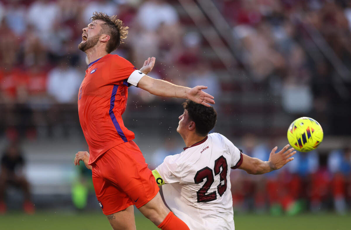 Clemson defender Adam Lundegard (3) and South Carolina forward Harrison Myring (23) go up for a loose ball during the Gamecocks’ game against Tigers in Columbia on Friday, August 30, 2024.