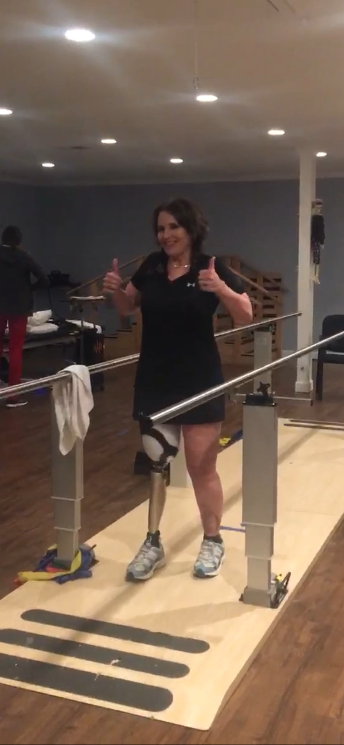 Shawn Kiser smiles during physical therapy following a boat crash on Lake Murray where she suffered massive trauma and her husband was killed.