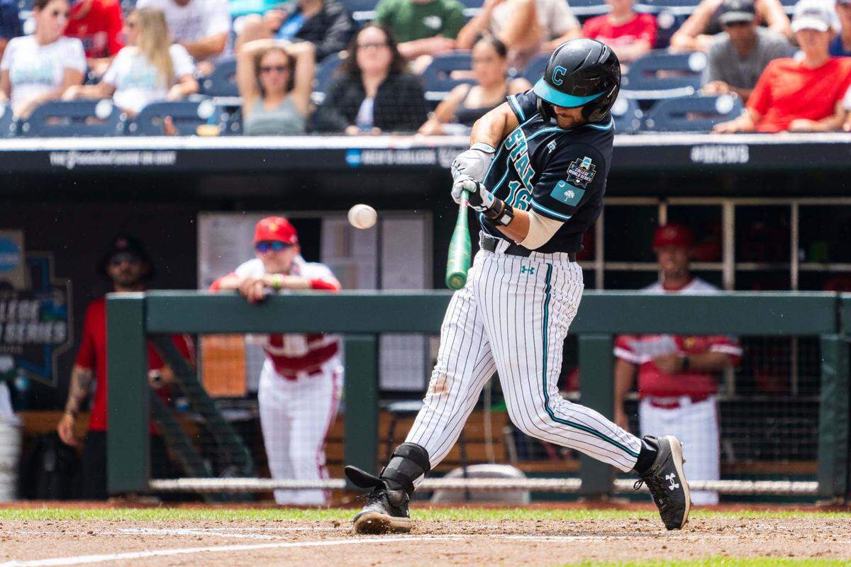 Coastal Carolina Chanticleers first baseman Colby Thorndyke (16) hits a single against the Louisville Cardinals during the fifth inning at Charles Schwab Field.