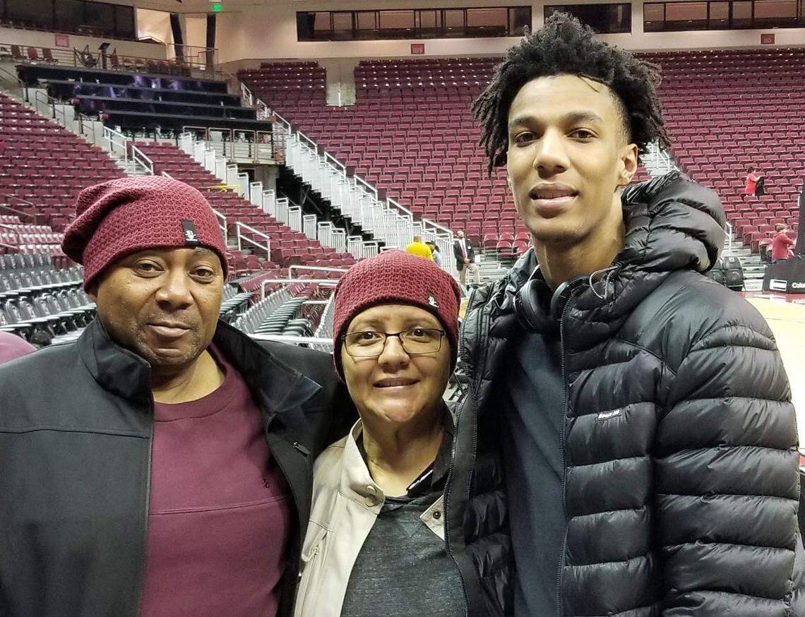 A.J. Lawson with his uncle Jerome Lawson and late aunt Laronistine Dyson Lawson after one of his games.