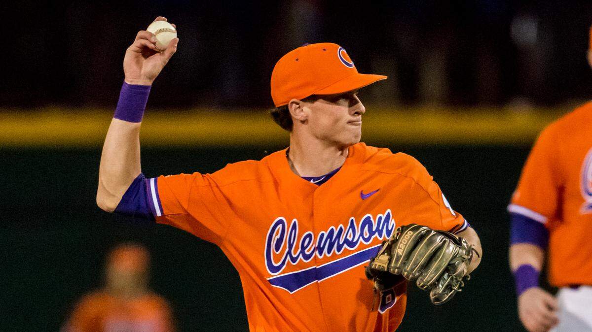 Clemson Tigers shortstop Logan Davidson (8) throws out a South Carolina Gamecocks batter during the first inning at Founders Park.
