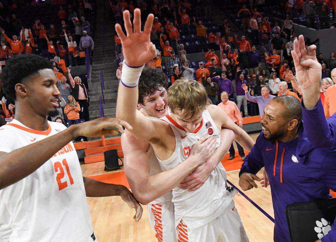 January 21, 2023; Clemson, SC; Clemson sophomore forward PJ Hall (24) hugs forward Hunter Tyson (5) near freshman forward Chauncey Wiggins (21) after the Tigers beat Virginia Tech at Littlejohn Coliseum in Clemson, S.C. Saturday, January 21, 2023.