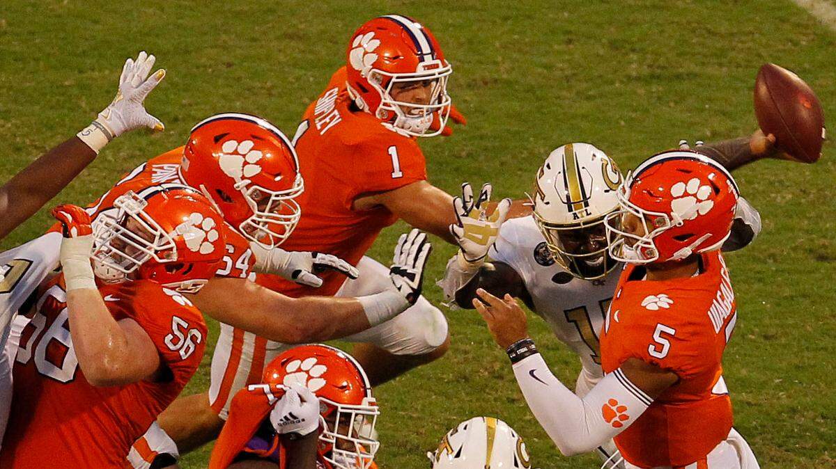 Clemson quarterback D.J. Uiagalelei (5) throws under heavy pressure from Georgia Tech during third-quarter action in Clemson, S.C. on Saturday, Sept. 18, 2021.