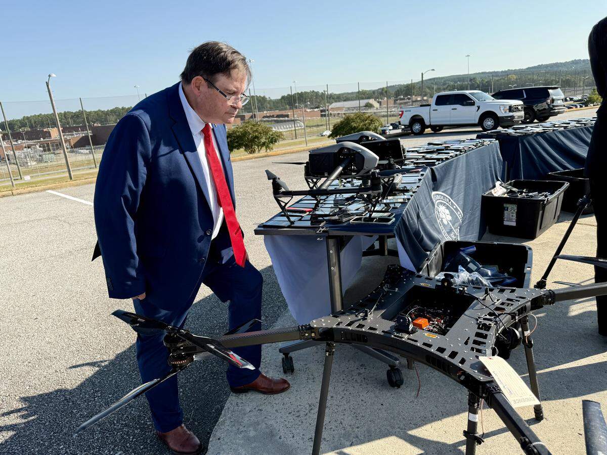 South Carolina Department of Corrections Director Joel Anderson inspects a desk-sized drone seized at an S.C. prison.