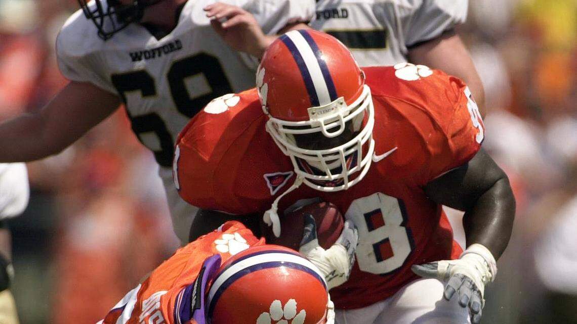 (SATURDAY 08 SEP 01 -- PHOTO: RICH GLICKSTEIN / THE STATE) -- Clemson defensive tackle Nick Eason (98) picks up a Wofford fumble during the third quarter in front of offensive tackle Steward Williams (61-bottom) and fellow defensive tackle Jovon Bush (95) during Clemson’s 38-14 win over Wofford at Memorial Stadium in Clemson.