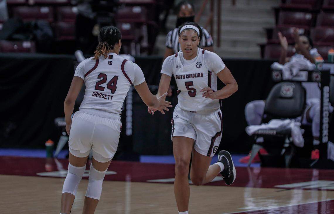 South Carolina Gamecocks guard LeLe Grissett (24) congratulates teammate Victaria Saxton (5) during the second half of action against the Temple Owls at the Colonial Life Arena.