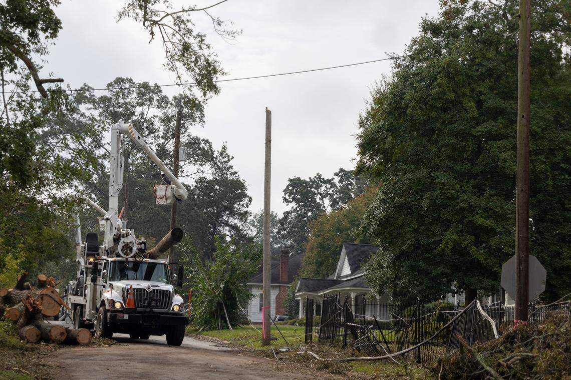 Utility lineman work to replace power poles and lines in Newberry after strong winds and rain blew through from Hurricane Helene on Monday, Sept 30, 2024.