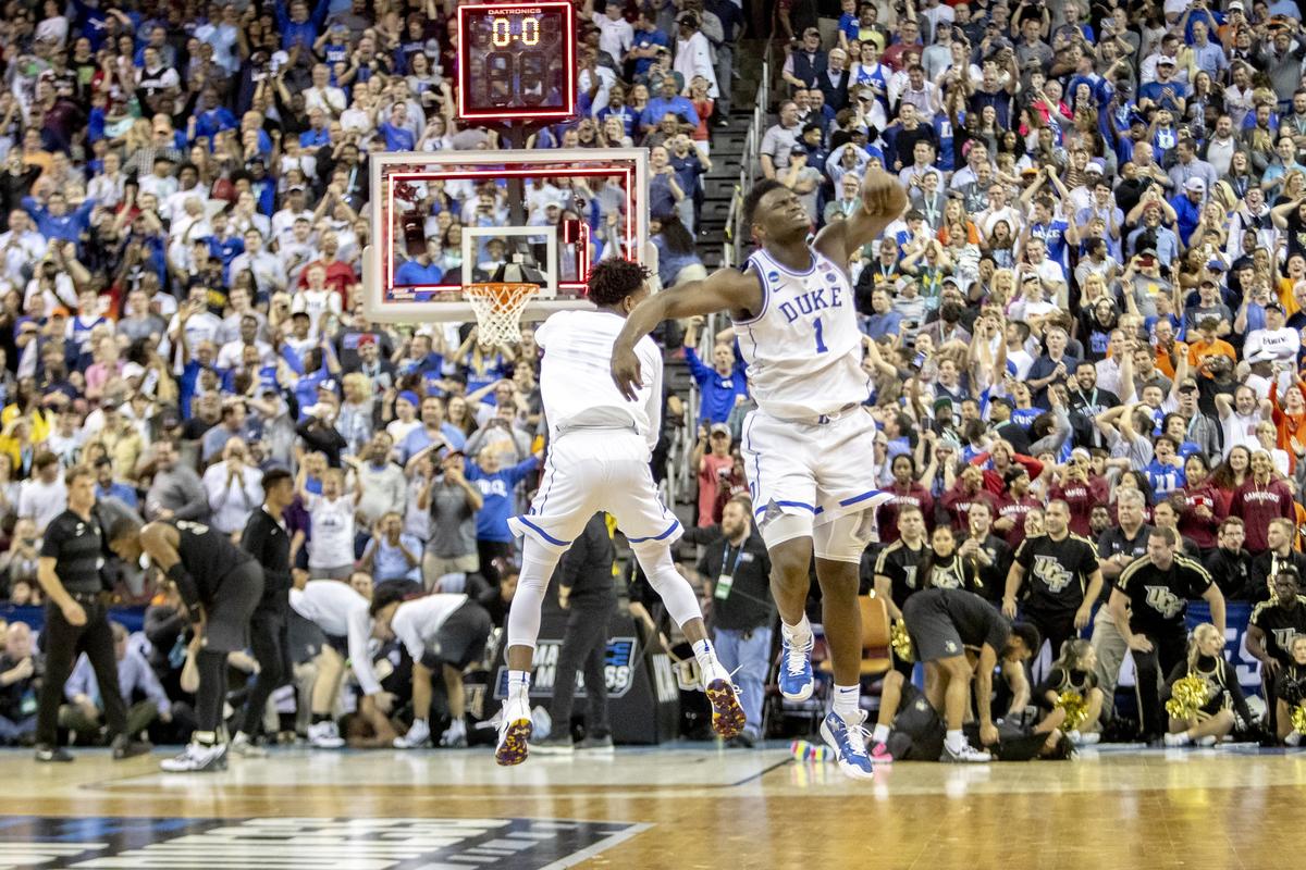 Duke Blue Devils forward Zion Williamson (1) celebrates with another teammate after beating the UCF Knights after they missed a last second shot in the second round game of the NCAA Tournament at Colonial Life Arena Sunday March 24, 2019, in Columbia, SC.