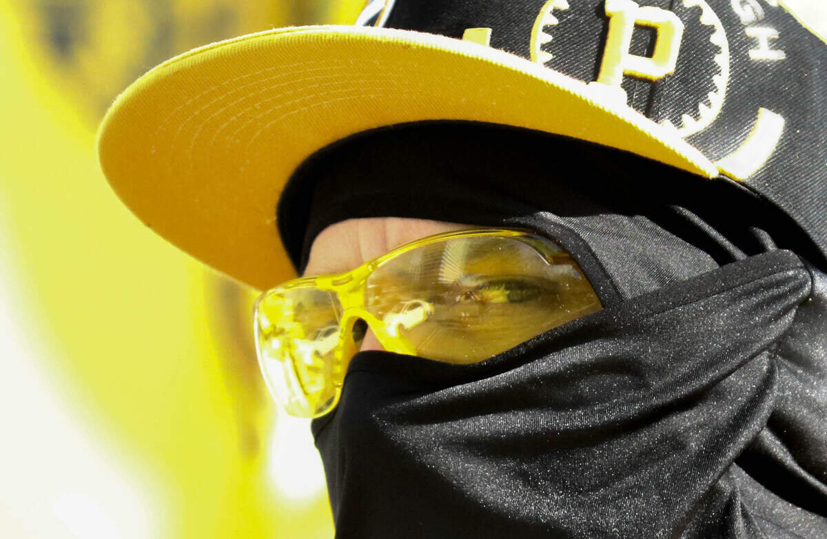 A member of The Proud Boys watches people during a protest on January 6, 2021 in Columbia, SC. A small contingent of the far-right organization gathered on the South Carolina State House grounds to show support for Donald Trump on the day Congress was beginning the electoral vote count declaring Joe Biden the US President. 