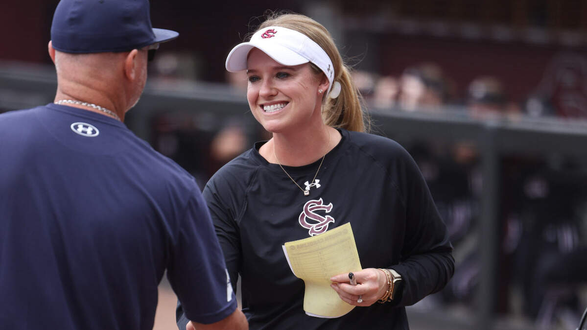 South Carolina head coach Ashley Chastain Woodard meets North Florida head coach Jeff Conrad before the Gamecocks’ game against North Florida at Beckham Field in Columbia on Saturday, May 17, 2025.