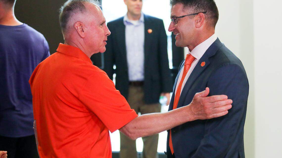 Clemson head baseball coach Erik Bakich speaks with former Clemson head baseball coach Jack Leggett during the introductory press conference at Doug Kingsmore Stadium, June 16th, 2022.