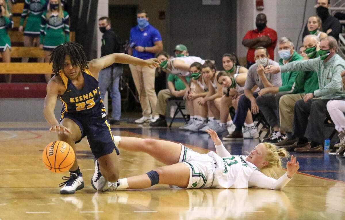Keenan’s MiLaysia Fulwiley (23) regains control of a ball swiped by Bishop England’s Lily Woods (23) during the 3A state championship game at the USC Aiken Convocation Center on Friday, March 5, 2021.