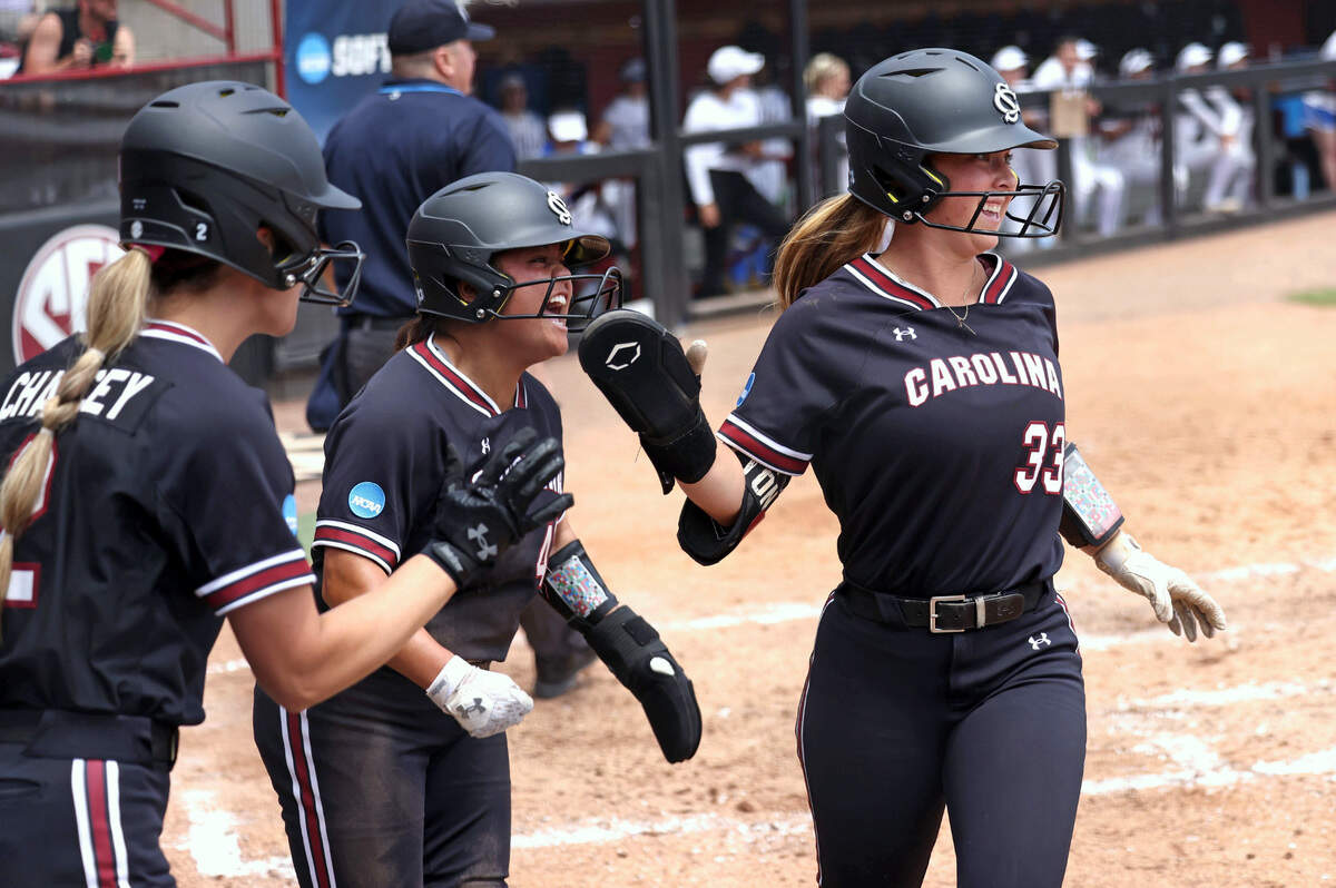 South Carolina celebrates Lexi Winters’ 2-RBI single in the fifth inning of Saturday’s Super Regional game against UCLA at Carolina Softball Stadium.
