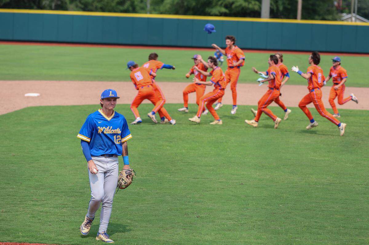 Lexington High players clear the field as James Island celebrates their Class 5A Division I Baseball championship win played at Riley Field in Sumter on Saturday, May 31, 2025.