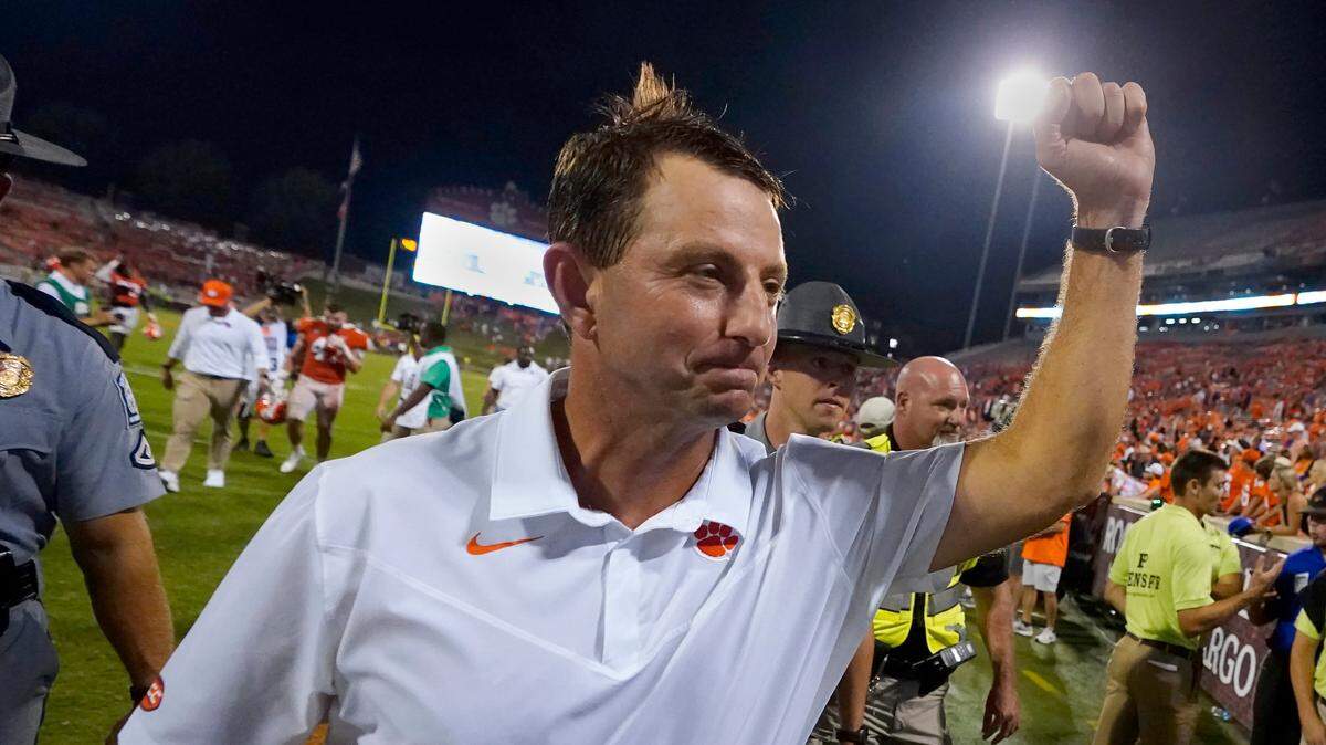 Clemson head coach Dabo Swinney pumps his fist to the crowd as he leaves the field after defeating Georgia Tech 14-8 in an NCAA college football game, Saturday, Sept. 18, 2021, in Clemson, S.C. (AP Photo/John Bazemore)