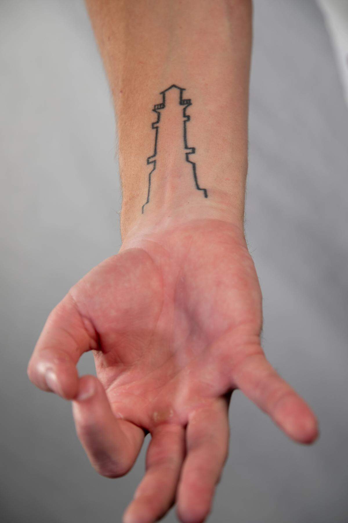 Ryan Hilinski and his brother Kelly Hilinski wear identical lighthouse tattoos in memory of their brother, Tyler Hilinski.