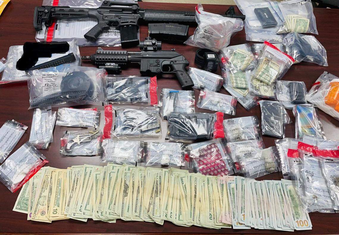 Drugs, guns and money were seized by deputies.