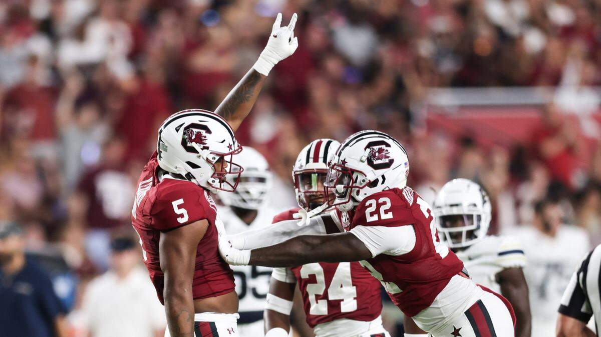 South Carolina edge Kyle Kennard (5) and teammate linebacker Bam Martin-Scott (22) celebrate a stop during the first half of Gamecocks’ game against Akron in Columbia on Saturday, September 21, 2024.