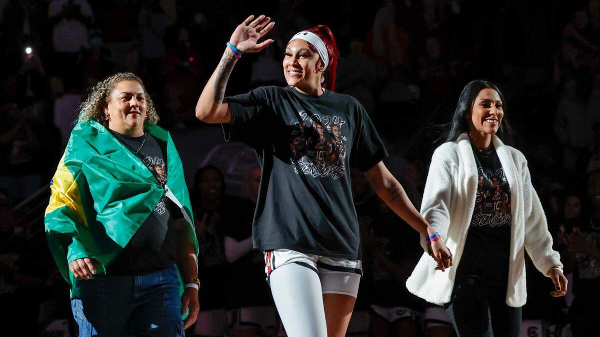 South Carolina’s Kamilla Cardoso (10), escorted by her mom and sister, waves to the fans during senior introductions before the Gamecocks played Tennessee in the Colonial Life Arena on Sunday, Mar. 3, 2024
