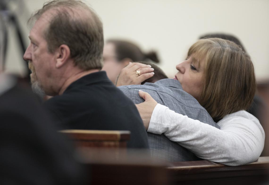 Julie Jones, the step-mother of Tim Jones, embraces her son, Trevor Jones, on Thursday during closing arguments of the sentencing phase of Tim Jones’ death penalty trial in Lexington. Timothy Jones, Sr. is seated to the left. 6/13/19