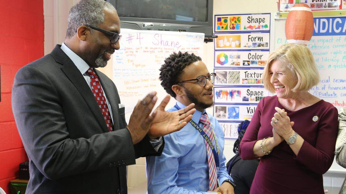 Richland 1 Superintendent Craig Witherspoon, left, joins state Superintendent of Education Molly Spearman in congratulating Hand Middle School teacher Robert Harris on being a finalist for S.C. Teacher of the Year on March 7, 2018.