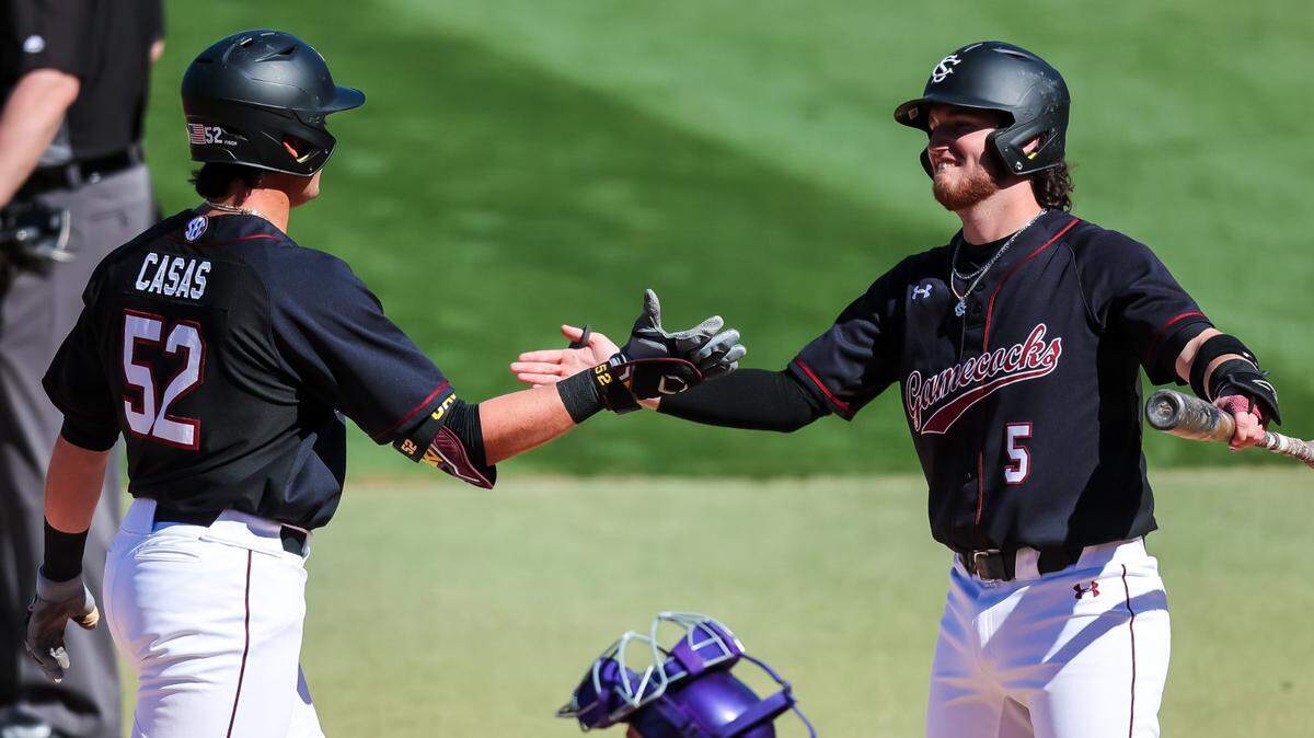 South Carolina Gamecocks infielder Gavin Casas (52) celebrates his first home run of the game with Talmadge LeCroy (5) against the Clemson Tigers at Founders Park in Columbia, SC, March 5, 2023.