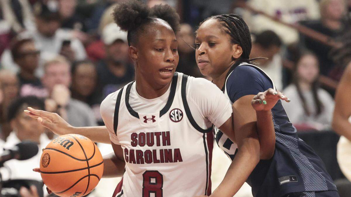 South Carolina's Joyce Edwards (8) drives around Penn State's Nyla McFadden (8) during the second half of action of their women's basketball game against Penn State at Colonial Life Arena on Sunday, Dec. 14, 2025.