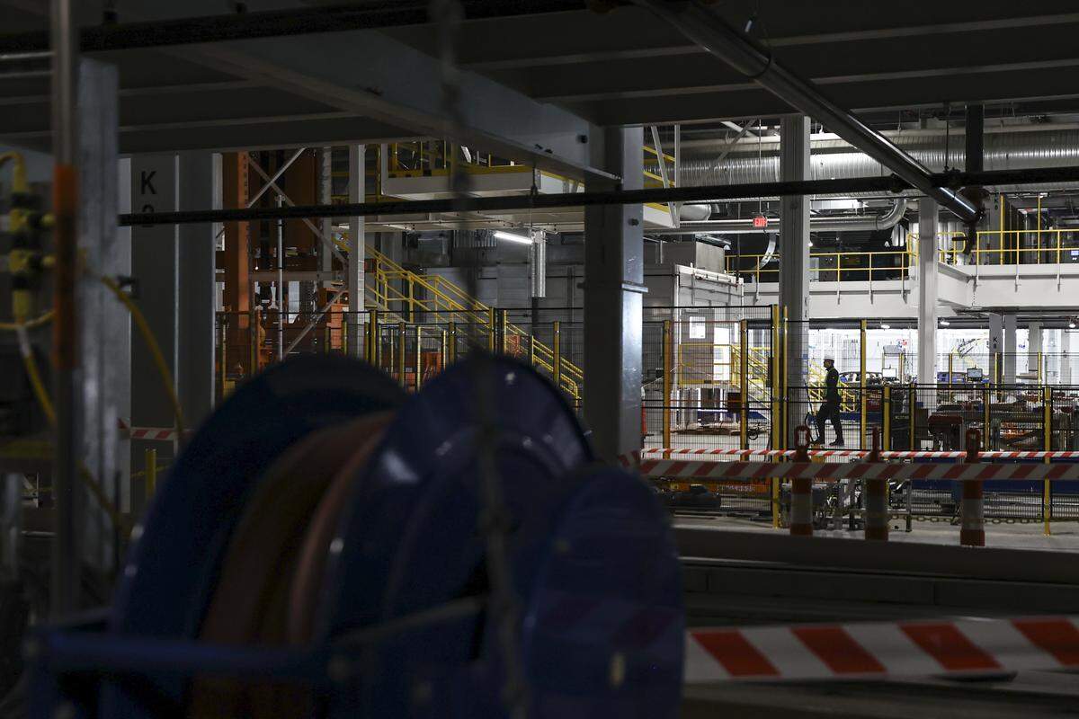 An employee walks through one of the buildings under construction at Scout Motors on Tuesday, Feb. 10, 2026. Work is being done on the 1,100-acre site to complete the electronic vehicle production facility by late 2026 to early 2027. 