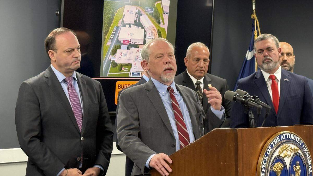 Creighton Waters, who leads the state grand jury, state Attorney General Alan Wilson (left) and 8th Circuit Solicitor David Stumbo (right) spoke at Thursday’s press conference about a major undocumented immigrant and forged document operation. 