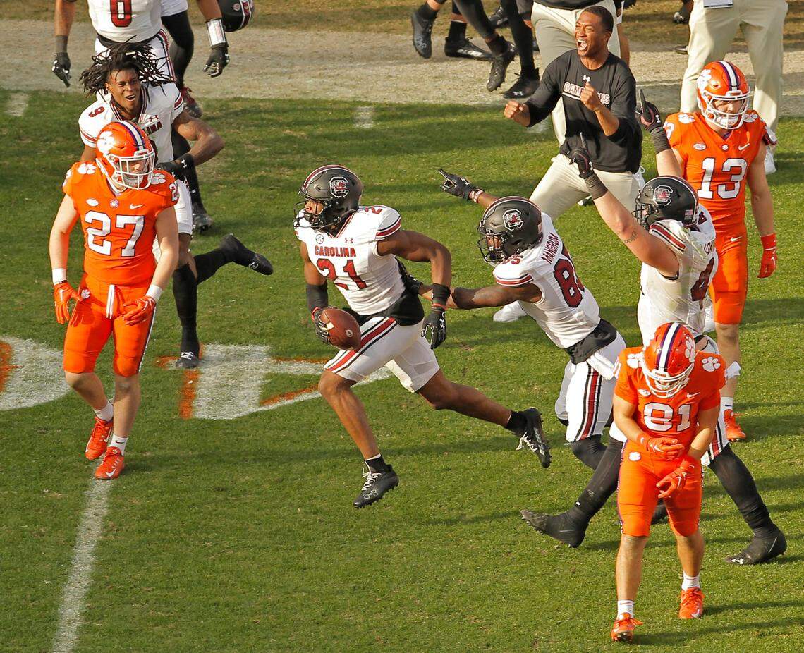 South Carolina defensive back Nick Emmanwori (21) and South Carolina wide receiver Payton Mangrum (85) celebrate after recovering a fumble by Clemson wide receiver Antonio Williams (0) during late, fourth-quarter action in Clemson, S.C. on Saturday, Nov. 26, 2022.