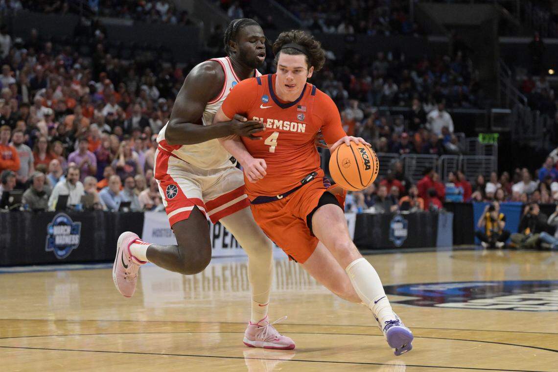 Clemson Tigers forward Ian Schieffelin (4) controls the ball against Arizona Wildcats center Oumar Ballo (11) in the first half fin the semifinals of the West Regional of the 2024 NCAA Tournament at Crypto.com Arena.