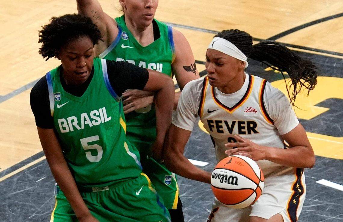 Indiana Fever forward-center Makayla Timpson (21) tries to gather the ball as BrazilÕs Ayla McDowell (5) defends during an WNBA game May 4, 2025 at Carver-Hawkeye Arena in Iowa City, Iowa.