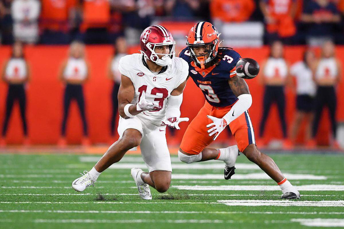 Sep 20, 2024; Syracuse, New York, USA; Stanford Cardinal wide receiver Elic Ayomanor (13) makes a catch against Syracuse Orange defensive back Clarence Lewis (3) during the second half at the JMA Wireless Dome.