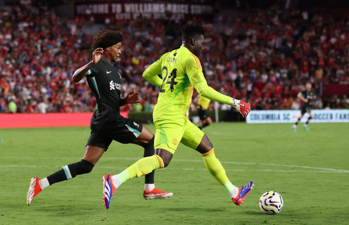 Liverpool forward Harvey Blair (86) defends as Manchester United goalkeeper André Onana (24) moves the ball out during the Rivals in Red International Friendly soccer match between Manchester United and Liverpool in Columbia on Saturday, August 3, 2024.