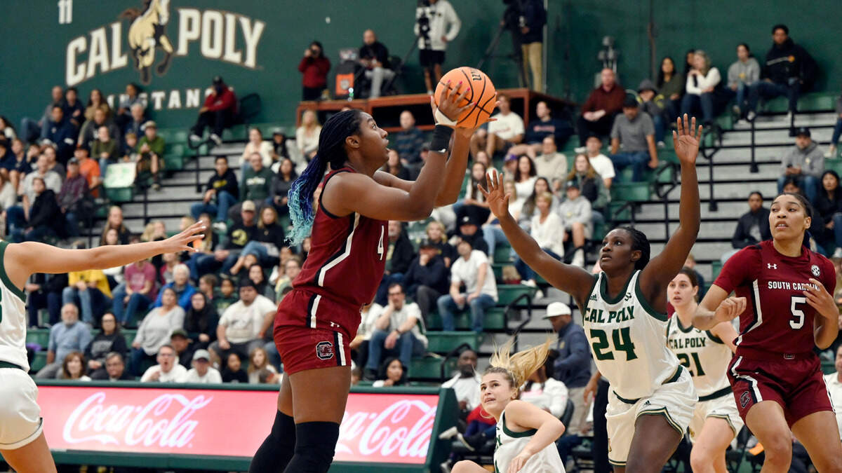 South Carolina forward Aliyah Boston (4) shoots as Cal Poly guard Oumou Toure (24) defends in the first half of an NCAA college basketball game, Tuesday, Nov. 22, 2022, San Luis Obispo, Calif. (AP Photo/Nic Coury)