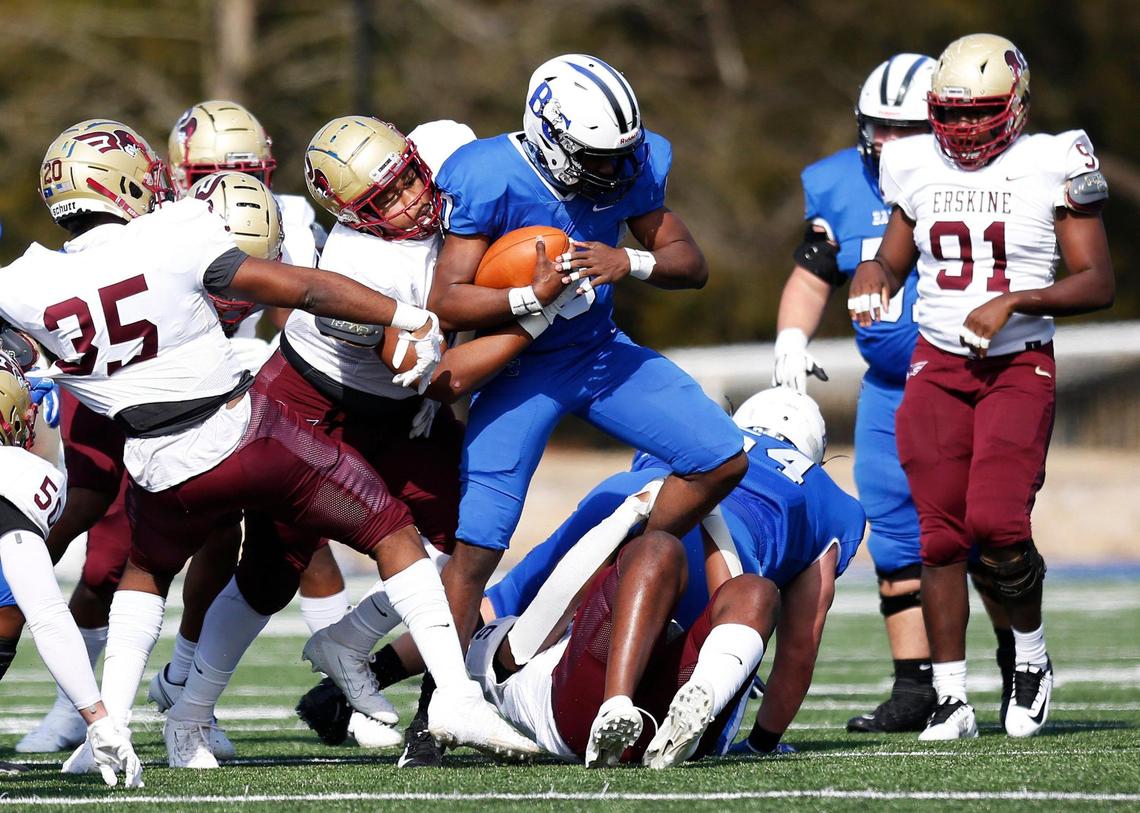 Erskine defensive lineman Isaac Stenhouse (92) takes down Barton quarterback Jaquan Lynch (0) in the first quarter Saturday.