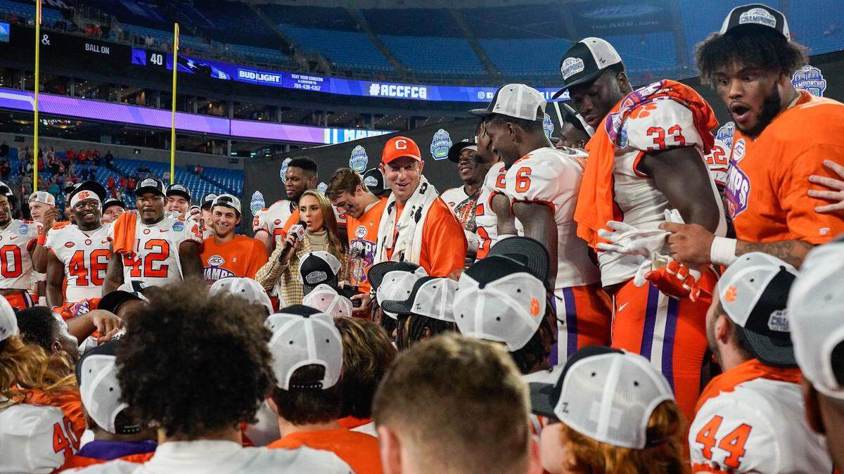 Dec 3, 2022; Charlotte, North Carolina, USA; Clemson Tigers head coach Dabo Swinney is interviewed alongside his team on the stage during the victory celebration after the win over North Carolina Tar Heels at Bank of America Stadium. Mandatory Credit: Jim Dedmon-USA TODAY Sports