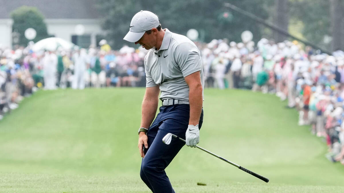 Rory McIlroy reacts to his shot after hitting from the first fairway during the second round of The Masters golf tournament.