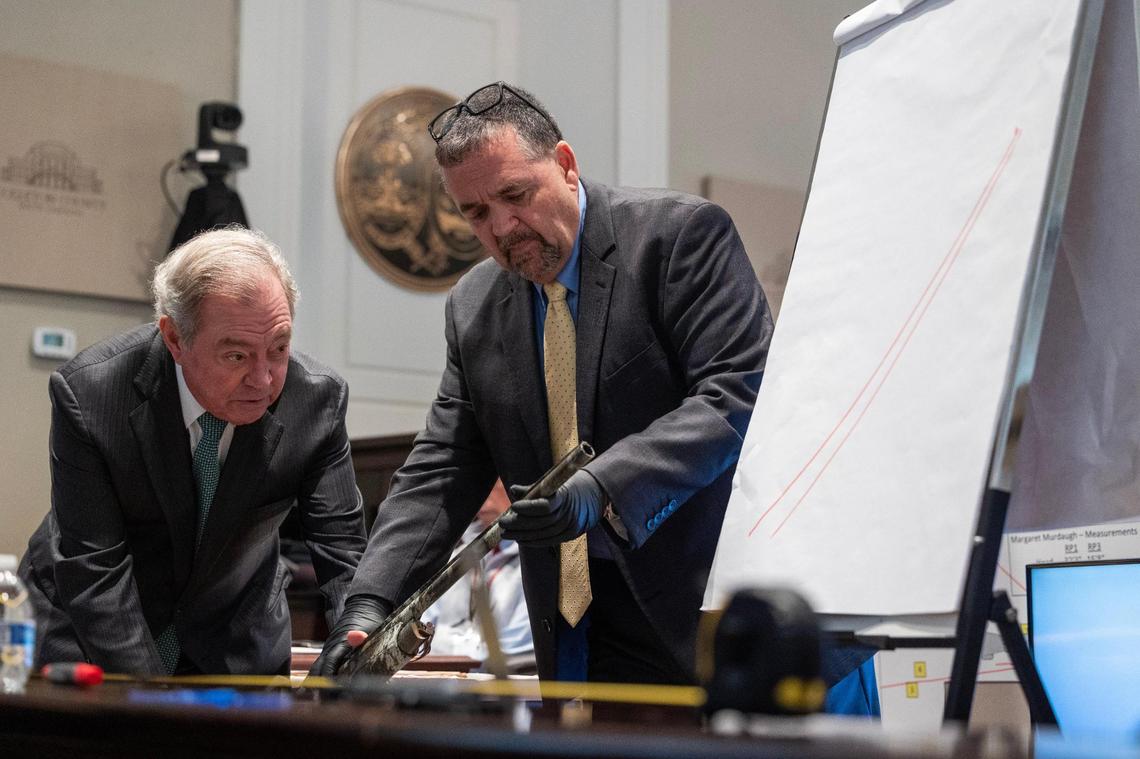 Defense attorney Dick Harpootlian and Kenneth Kinsey estimate the distance of a shotgun during Paul Murdaugh’s murder during Alex Murdaugh’s trial for murder at the Colleton County Courthouse on Thursday, February 16, 2023. Joshua Boucher/The State/Pool
