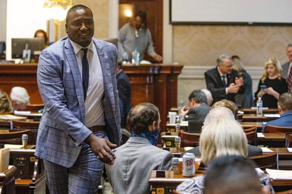 Representative Jermaine Johnson speaks with colleagues before session at the South Carolina Statehouse on Wednesday, December 1, 2021. 